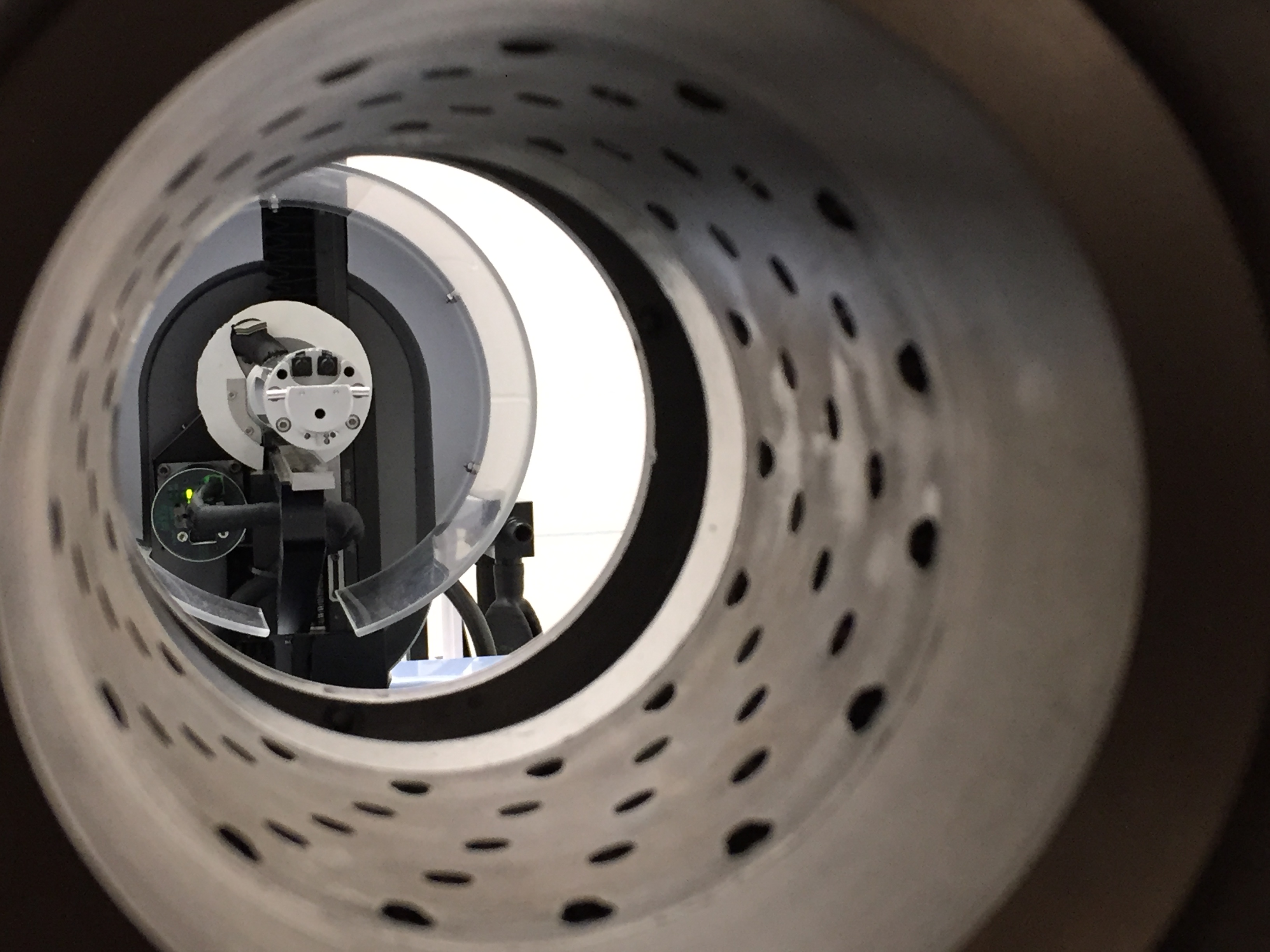 View through the multi-pinhole collimator of the MIRF VECTor/CT scanner, showing the rotating detector assembly at the centre.